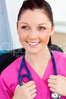 Pretty female surgeon smiling at the camera
