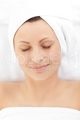 Portrait of a relaxed woman lying on a massage table