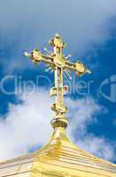 Close-up of Golden crucifix and Cupola of Orthodox church