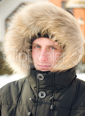 Man in warm jacket with furry hood