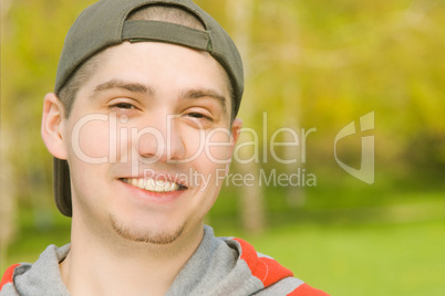 Smiling Casual young male in park