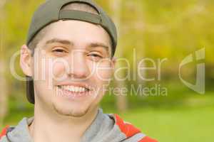 Smiling Casual young male in park