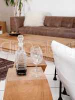 Champagne glasses with modern couch in background