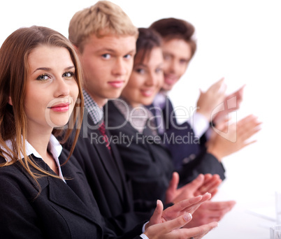 Colleagues applauding during a business meeting