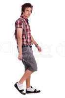 Casual young guy in walking posture