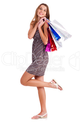 Cute happy woman holding her shopping bags