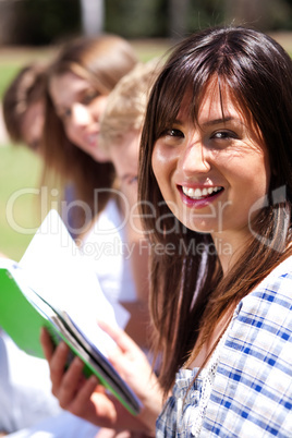 Smiling modern female student in focus