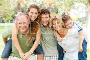 garandparents giving piggyback ride