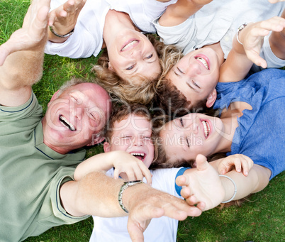 Happy family lying as a circle