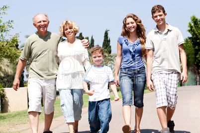 Extended family group walking down the pathway