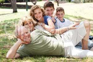 Family lying  in the park