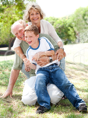 Grandparents playing with grandson