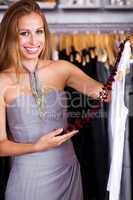 Gorgeous woman in wardrobe store