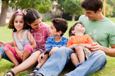 Happy family enjoying summer day in the park