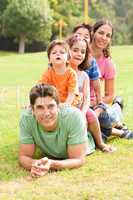 Portrait of happy family looking at camera