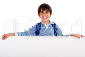 Charming kid holding blank board