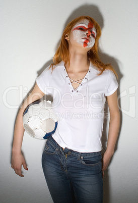 english football makeup girl standing in front of a wall
