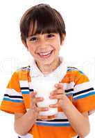 Young kid holding a glass of milk