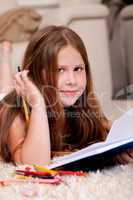 Closeup of cute little girl doing her homework