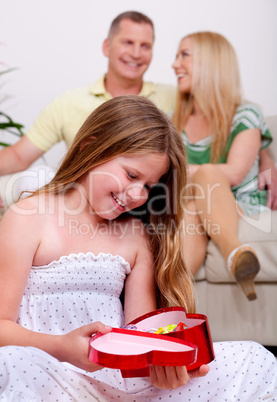 An cute girl happy to see her christmas gift
