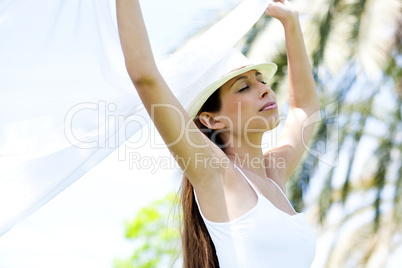Beautiful woman enjoying breeze on a sunny day