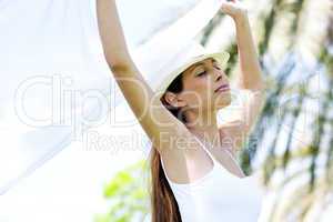 Beautiful woman enjoying breeze on a sunny day