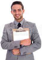 Young business man holding a clip board