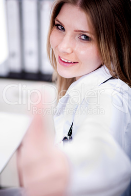 Female Doctor showing thumbs up sign