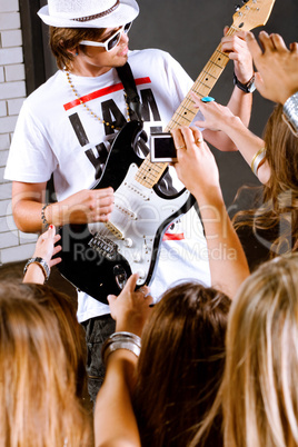 Guitarist performing for his adoring fans