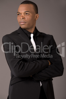 Young black american business man with folded hands