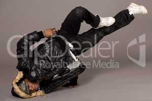 Portrait of hip hop dancer in head stand