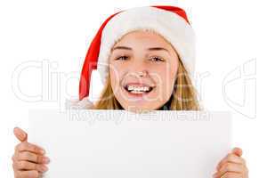 Women with santa cap smiling and holding a blank board