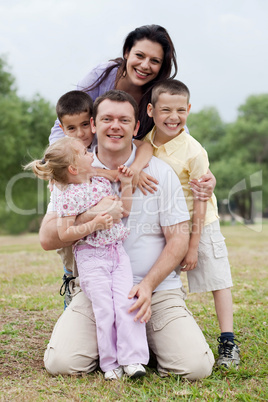 Close up shot of cheerful family posing together