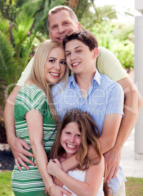Portrait of loving father holding his family
