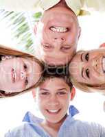 Happy family smiling and joining their heads together