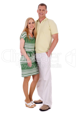 Full length of smiling middle aged couple standing and looking at you