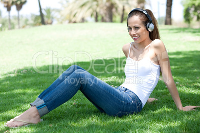 Young woman listening to music and relaxing
