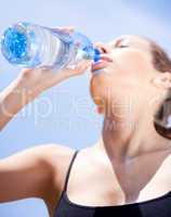 Fitness woman drinking water