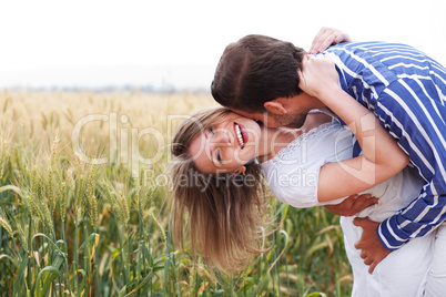 Happy young Couple hugging and kissing eachother