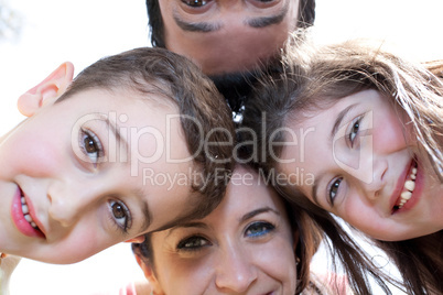 Closeup portrait of a happy family in circle