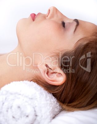 Close up shot of Sleeping young woman in the spa