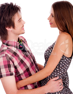 Portrait of smiling young romantic couple holding and looking each other