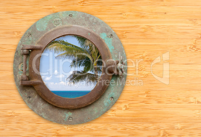 Antique Porthole with Tropical Beach View on Bamboo Wall