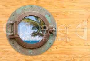 Antique Porthole with Tropical Beach View on Bamboo Wall