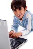 Cute smiling caucasian kid with laptop