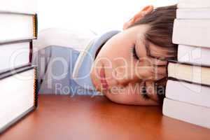 School boy sleeping on table