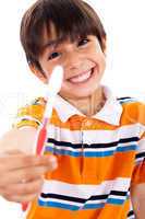 Boy showing the toothbrush
