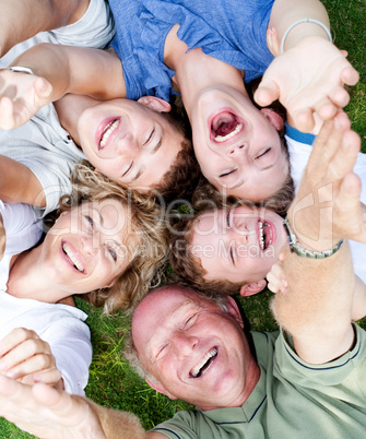 Multi-generation family lying in circle
