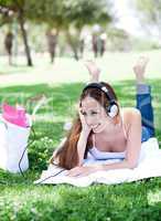 Portrait of a beautiful young lady enjoying music