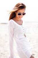 Beautiful young woman posing in sunglasses